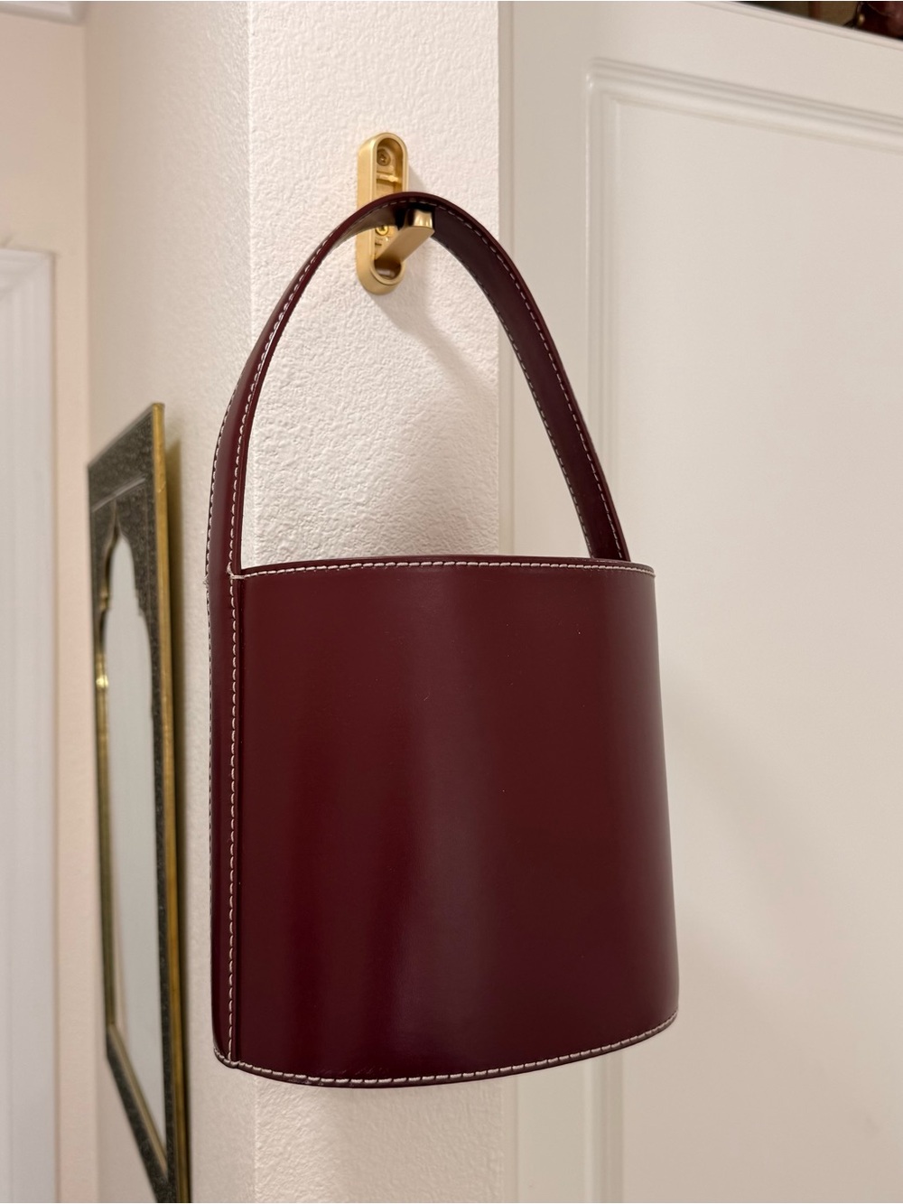 STAUD Burgundy Leather Bucket Tote with White Stitching